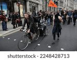 Small photo of A breakaway group of protesters lead by a cyclist towing a sound system march through central London their during a large anti government rally on March 26, 2011 in London, UK.