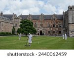 Small photo of People play croquet on a lawn court at the Bishop's Palace of the historic Wells Cathedral on August 20, 2020 in Wells, UK. The landmark Somerset city is described as the UK's smallest city.