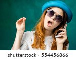 Small photo of Hand gesture,Woman speaking with smartphone and shows keep silence with hand.Girl get tired to speak on mobile phone,don`t want listen.Hand shows stop blah blah symbol of speaking mouth