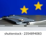 Small photo of apple iPhone lightning to usb c switch forced by European Parliament eu flag iPad already using usb-c