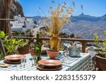 Holidays on Gran Canaria: Restaurant with a view, house with a traditionally set dining table in Artenara