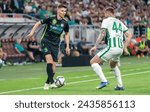Small photo of Budapest, Hungary – May 11, 2022. Paks centre-back Oliver Tamas against Ferencvaros midfielder Stjepan Loncar during Hungarian Cup 202122 final match Ferencvaros vs Paks (3-0).