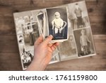 Old Man Holds His Old Photos...