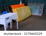 Small photo of bulky waste, old mattresses, window frames, table on street before it is collected, problem of shredding garbage, disposal of bulky refuse, is diverted for recycling, pollution of nature