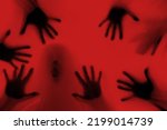 eerie blurry hands of people as if they have been trapped behind glass, dense fabric, wrap, ghost, spirit trying to reach out from afterlife, concept of violence, nightmares, halloween horror