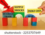 Small photo of olored wooden blocks design, red down arrow recession, concept monetary recession, inflation, slowdown in economic growth, economic structure instability, US trade with China, war, energy costs