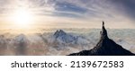 Small photo of Adventurous Man Hiker standing on top of icy peak with rocky mountains in background. Adventure Composite. 3d Rendering rocks. Aerial Image of landscape from British Columbia, Canada. Sunset Sky