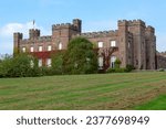 Small photo of SCONE, GREAT BRITAIN - SEPTEMBER 11, 2014: This is an old Gothic Scone Palace, near which is a replica of the famous Scottish Stone of Scone.
