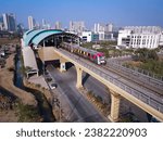 Small photo of Navi Mumbai, India, 2023. Aerial shot of metro tracks in urban areas of navi Mumbai, taloja, kharghar with metro running on the tracks. A very useful addition to existing MAHA METRO rail network