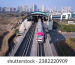 Small photo of Navi Mumbai, India, 2023. Aerial shot of metro tracks in urban areas of navi Mumbai, taloja, kharghar with metro running on the tracks. A very useful addition to existing MAHA METRO rail network