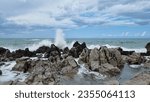 Small photo of Sea surf that expands in the air during. Sea driven by the fresh Mistral wind. Freedom of nature. Ancient rocks that on the coast embrace the impetuous sea that breaks furiously