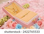 Small photo of The wedding dowry consisted of a box of gold rings and necklaces decorated with crocheted jasmine flowers