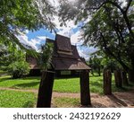 Small photo of Traditional Thai gabled roofs of the Baan Dam Museum in historic village of Chiang Rai Thailand