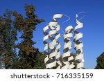 Small photo of Modern white serpentine shaped Aquaporin fountain by Jaroslaw Kozakiewicz, outside the Copernicus Science Centre, Warsaw, Poland, 2016 October 4