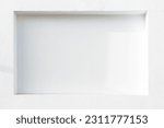 Small photo of background of white wall with indentation in plastered wall forming a natural rack - all in white