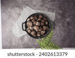 Small photo of Large and delicious live Korean cockles against a gray background