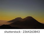 one of Asia's golden sunrises located on the Dieng Plateau, the peak of Mount Prau Wonosobo, Central Java, Indonesia