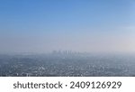 Small photo of The vastness of Los Angeles unfolds under the hazy sunlight, revealing the city's dense neighborhoods with the drone's all-seeing eye, highlighting the urban sprawl in the clarity of day.