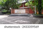 Small photo of Depok, Indonesia ( Feb 22th 2024) park which has a signpost for the name of the faculty at the University of Indonesia which means "Faculty of Cultural Sciences, University of Indonesia" in english