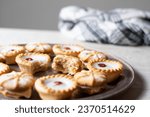 Small photo of commecial photos of Viennese Whirls and Bakewell tarts on metal tray and with coloured backgrounds