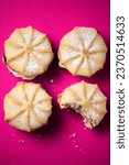 Small photo of commecial photos of Viennese Whirls and Bakewell tarts on metal tray and with coloured backgrounds