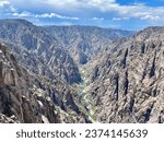 a view of a black canyon with a river running through it