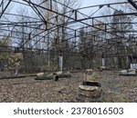 Small photo of The amusement park in Pripyat, Chernobyl, frozen in time, a chilling testament to the abrupt abandonment of the city and its once-lively attractions.
