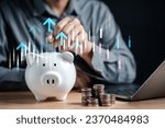 Small photo of Businessman saving money coin in piggy bank for growth to success goal. Funds and stock Invest profits. assets, wealth, lucrative. investment and retirement concept.