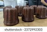 Small photo of Baking Surefire Canele brown delicious