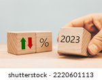 Small photo of Year 2023 business concept. Economic and financial analysis, interest rates, stocks, bonds, ranking, mortgage, loan rates, Percent, up or down, arrow symbol