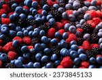 Background from healthy fruits. Blueberries, blackberries and raspberries. Flat lay. Vitamins in natural products. Berries.