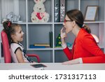 Small photo of Caring mom or female speech and language therapist teaching stuttering cute preschooler child girl daughter learning correct pronunciation having stutter difficulty voice ability problem concept
