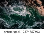 Small photo of Waves of water of the river and the sea meet each other during high tide and low tide. Whirlpools of the maelstrom of Saltstraumen, Nordland, Norway