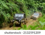 Small photo of Pos Gob, Gua Musang, Kelantan, Malaysia, 24.2.2020 - A convoy of 4X4 wheel drive vehicles to the forest in Gua Musang Kelantan..There is a motion blur effect in photo to show a movement effect.