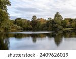 Small photo of Autumn scene reflection over pond. Grist mill pond.