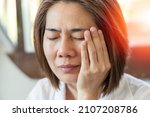 Small photo of TMD and TMJ healthcare concept: Temporomandibular Joint and Muscle Disorder. Asia man hand on cheek face as suffering from facial pain, mumps or toothache