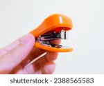 Small photo of Tasikmalaya, West Java, Indonesia; Nov 15 2023, A stapler is a paper clip used to combine sheets with metal clips, called staples. With an ergonomic design, staplers provide ease of use in drafting do