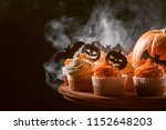 Cupcake And Pumpkin On A Dark...