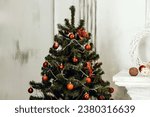 Small photo of Green christmas tree with red Babbles