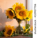 Sunflowers In A Glass Vase On A ...