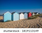 A Row Of Colourful Beach Huts...