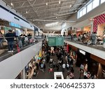 Small photo of Jersey City, USA - November 24, 2023: Crowded shopping mall, the Mills at Jersey Gardens, on Black Friday and Thanksgiving
