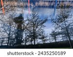Small photo of London, UK, 25 January 2024: Multiple exposure in camera image background Arcelormittal Orbit, London Stadium and waterworks river