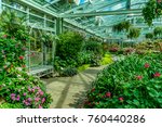 Small photo of Structure of green house roof with colorful flowers