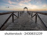 wooden walkway on the beach, walkway towards the sunset, Campo Soto beach (Cadiz) Spain