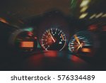 Sports Car Drives Fast at Night, Shows Interior of Car Including Speedometer and Tachometer