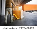 Small photo of Workers Unloading Packaging Boxes on Pallets into The Cargo Container Trucks. Loading Dock. Shipping Warehouse. Delivery. Shipment Goods. Supply Chain. Warehouse Logistics Cargo Transport.