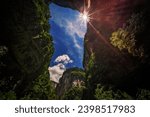 Small photo of Sun shining through the natural rocky arch and karst landscape of the Longshuixia Fissure National park, Wulong country, Chongqing, China