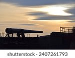 Small photo of Whidbey Island, WA USA November 20 2018: Fort Casey gunnery cannon at sunset on Whidbey Island in Washington state
