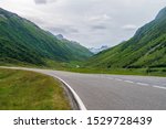 Scenic road Silvretta high Alpine route with green mountains, Austrian Alps